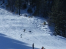 Snowboarders at the bottom of Goldrush at Mt High