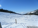 Snow-covered ski slopes at Mountain High with Table Mountain in background. - Wrightwood CA Photos