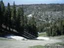 Mounds of snow left where jumps used to be during the winter season on Lower Chisolm run at Mountain High